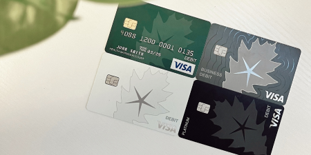 An image of four OakStar Bank Visa debit cards.